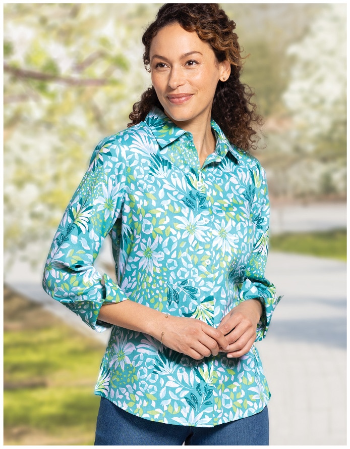 woman standing on paved road with light blue floral 3/4 sleeve blouse